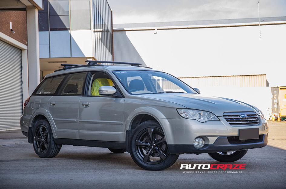SUBARU OUTBACK BADGER GLOSS BLACK DARK TINT FACE