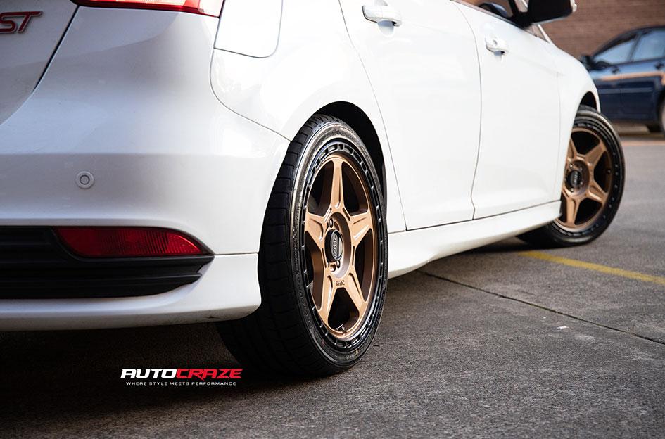 FORD FOCUS 5 STUD ALPINE BRONZE W BLACK LIP WHEELS